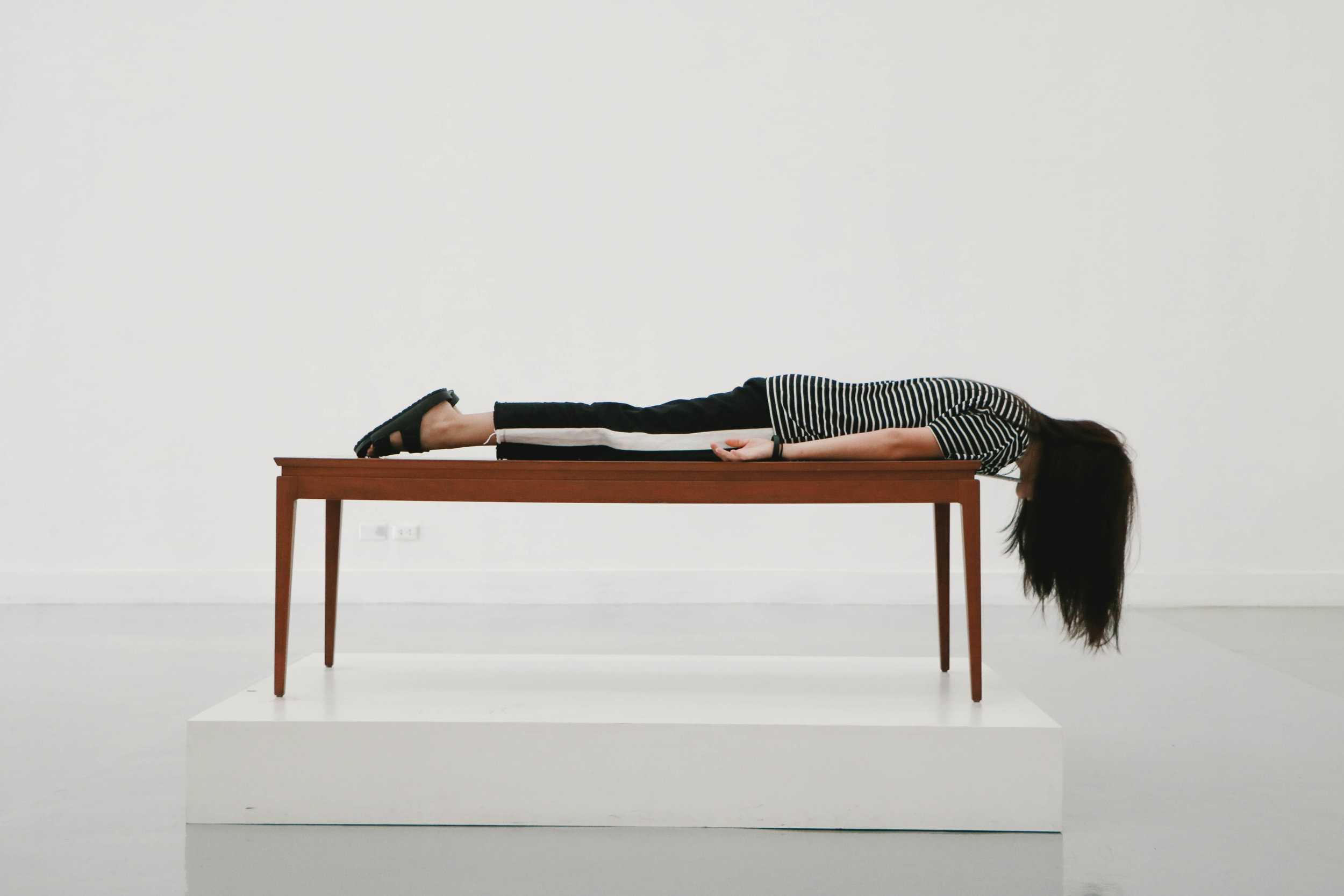 Person lying face down on a table