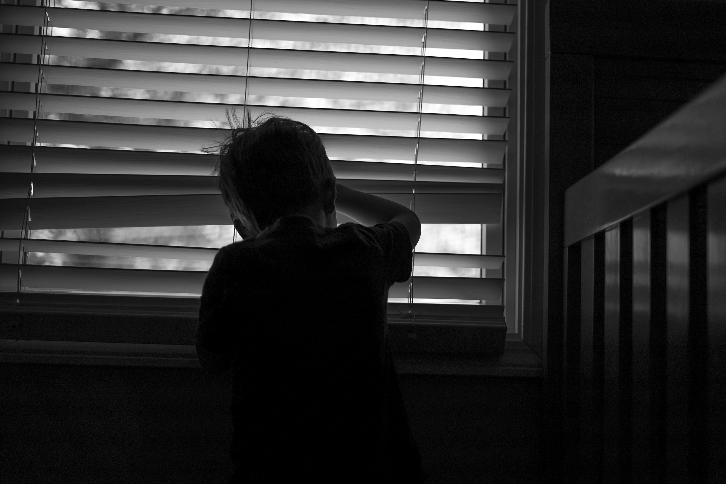 child looking out a window